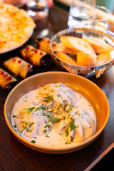 Aromatic khinkali and hearty Georgian dishes like khachapuri and mtsvadi on display. Perfect for food blogs, cultural visuals, or restaurant promotions with authentic flavors captured.