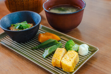 Japanese breakfast with natto, miso soup and side dishes
