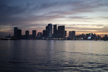 Fototapeta premium dusk view from the ferry in the river pretty lights phnom penh cambodia