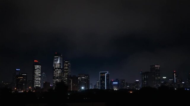 city skyscrapers at night with dark sky