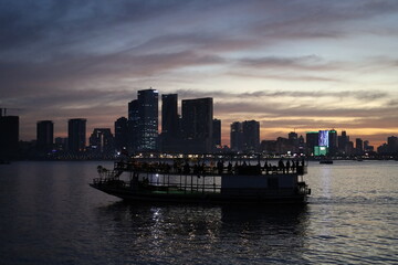 Fototapeta premium dusk view from the ferry in the river pretty lights phnom penh cambodia