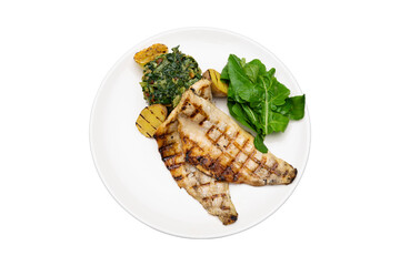Grilled Sea Bass Fillet Served with Vegetables and Greens on White Plate