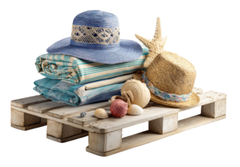 Summer vacation items on a wooden pallet.  Blue and light-colored beach accessories stacked on a white pallet, with seashells and starfish