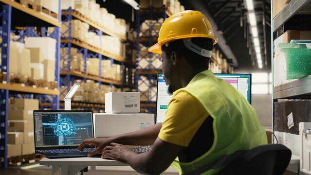 Guy using AI and scanner on awb shipping labels for tracking info with brain automation, package tracking software on a laptop nearby. Online shopping with neural networks support. Camera A.