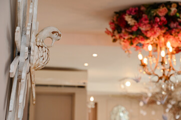 divine holy spirit art in a luxurious interior, religious decoration with an antique and elegant feel, symbolic dove ornament for a wedding or home decor, classic and romantic spiritual home accent

