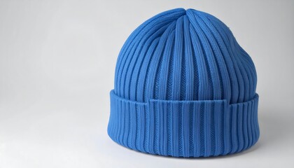 A vibrant, ribbed beanie in a rich royal blue hue sits angled against a plain white background.