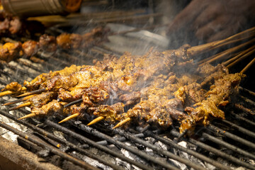 BBQ satay sold in a stall at night market