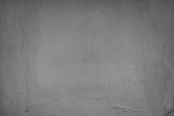 Fototapeta premium Muted-toned, aged concrete or stucco surface of an ancient Central European village wall, textured and cracked, under even lighting with no distinct objects or time indicators
