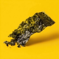 Dried seaweed sheet on yellow background