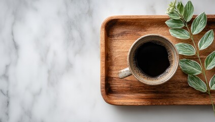 A cup of coffee on a wooden tray