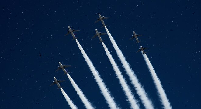 Aircraft formation flying in blue sky