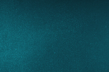 Abstract shiny, radiant texture background with different shades of dark turquoise color. Painted canvas, glitter concrete surface, studio backdrop, grainy textured effect