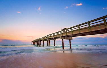 Obraz premium Sunset at St. Johns County Ocean Pier in St. Augustine Florida