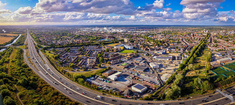 Aerial view of M4 motorway near Slough with houses, fields, and canal visible