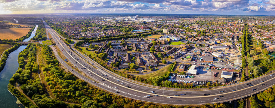 Aerial view of M4 motorway near Slough with houses, fields, and canal visible