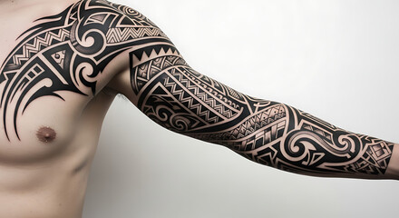 A shirtless man's torso showing an intricate black tribal Polynesian style full sleeve tattoo covering his arm, shoulder, and chest.