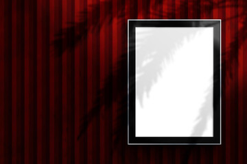 Modern poster mockup with black frame on a red striped wall background. Empty white space for artwork, design presentation, advertising and branding showcase.