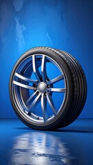 Silver alloy wheel on dark background