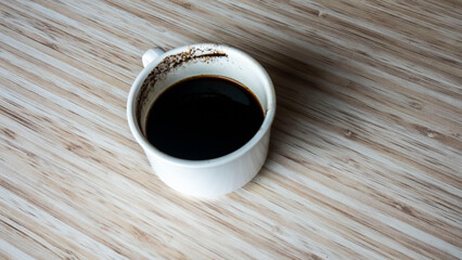 cup of coffee on wooden table