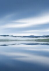 Fototapeta premium Misty Mountain Lake Reflection.