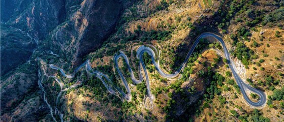 Aerial View of Winding Mountain Road Scenic Drive Through Nature