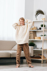 Authentic scene of a child indoors enjoying play and daily life after school, wearing a cozy sweater and relaxed pants in a bright home setting.