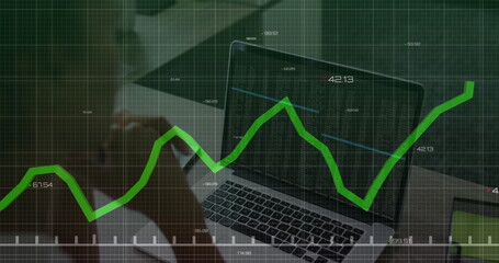 Analyzing businesswoman using smartphone and coffee mug at office desk, viewing laptop tablet chart