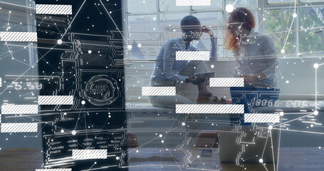 Office staff working in office attire at table using tablet with holographic overlay, copy space