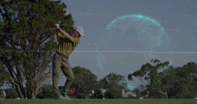 Swinging polo-clad adult male golfer striking golf ball with club on fairway, with digital globe - Powered by Adobe