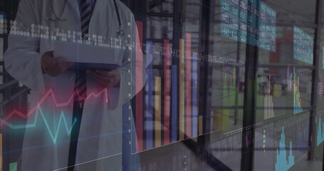 Monitoring doctor in labcoat holding tablet at data center, stethoscope, charts, copy space