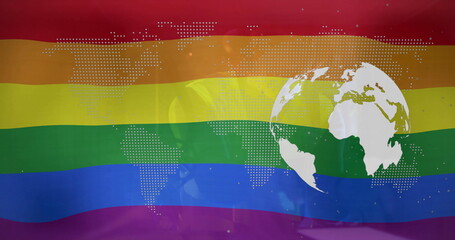 Fototapeta premium Displaying rainbow-striped flag with overlaid dotted world map and white globe on digital banner