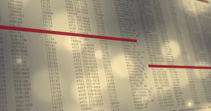 Displaying glass display panel showing codes and errors in control room, with red highlight bar