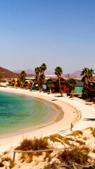 Fototapeta premium Tropical beach scene with colorful huts