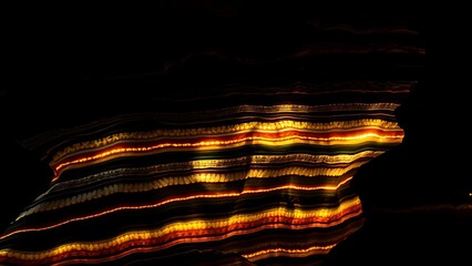 Glowing sedimentary rock layers pulsing with ancient energy, revealing Earth's geological history.