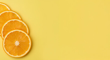 Minimalist Flat Lay of Sliced Oranges on a Solid Yellow Background with Blank Space