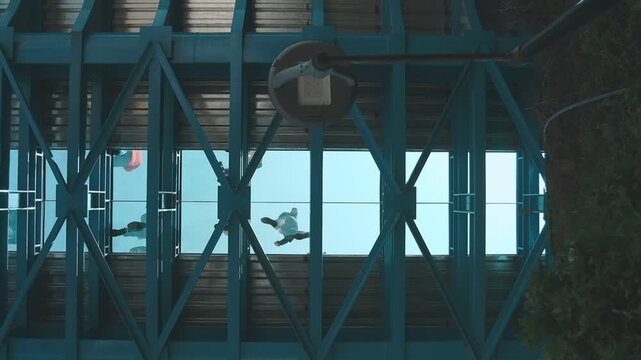 Lima peru aug 30 2025: People walking on the glass floor of the new la paz bridge in miraflores, connecting the city with modern design