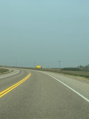 Fototapeta premium Driving down the highway on a asphalt pavement Road