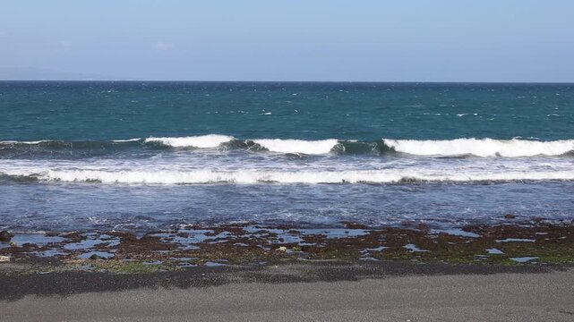 Keramas Beach in Blahbatuh, Bali with black sand