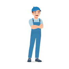 Happy Young Asian Man in Blue Overalls Standing with Arms Crossed and Smiling
