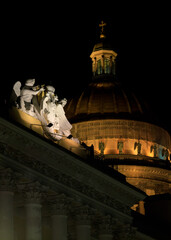 Illuminated Isaakievsky Cathedral dome behind Lobanov-Rostovsky House, a historic architectural monument in Saint Petersburg built between 1817 and 1820.