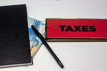 Financial taxes concept with money pen and notebook