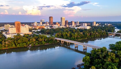 City skyline reflected on a river at sunset