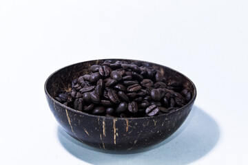 Closeup of Roasted Coffee in Coconut Shell Tropical Concept