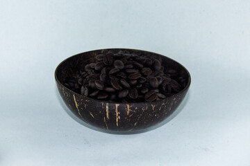 Organic Coffee Beans Inside Coconut Shell Isolated Background