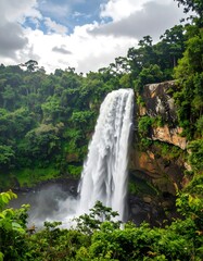 Obraz premium Beautiful Waterfall in Lush Green Valley.