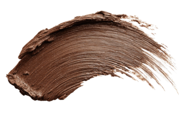 Close-up of a smudged, light brown makeup product, swirled and textured on a black background