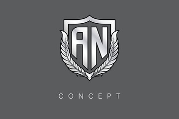 AN Creative Initial Letter Logo with Shield and Laurel Wreath Silver Metallic Branding Emblem on Gray Background.