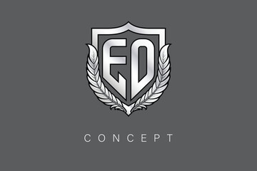 Obraz premium EO Creative Initial Letter Logo with Shield and Laurel Wreath Silver Metallic Branding Emblem on Gray Background.
