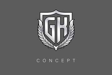 GK Creative Initial Letter Logo with Shield and Laurel Wreath Silver Metallic Branding Emblem on Gray Background.