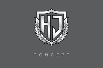 HJ Creative Initial Letter Logo with Shield and Laurel Wreath Silver Metallic Branding Emblem on Gray Background.